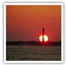 Sun setting behind the Cape May Lighthouse